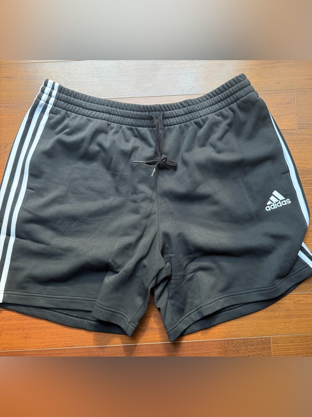 adidas Black Athletic Shorts with White Three-Stripe Detailing